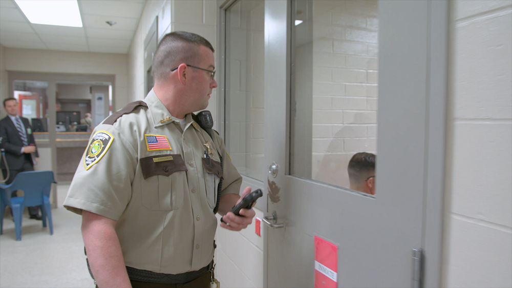 corrections officer doing security rounds