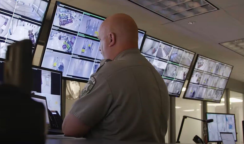 correctional-officer-observing-security-footage