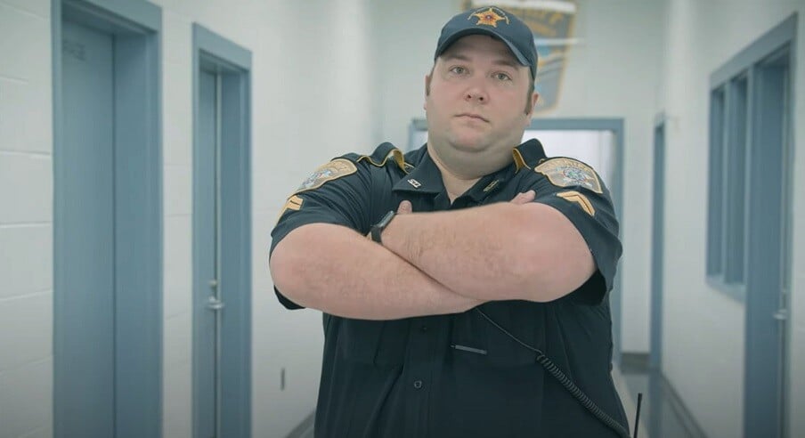 correctional-officer-with-his-arms-crossed (1)