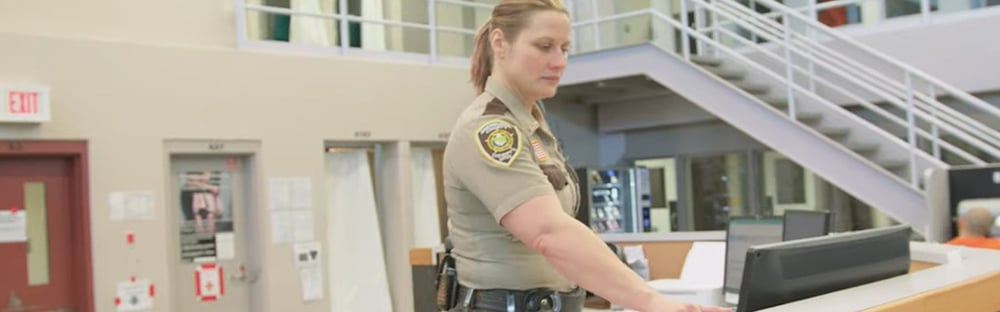 correctional-officer-working-on-computer