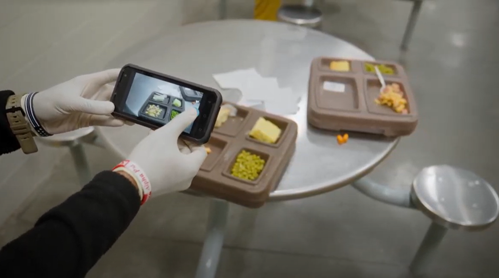 inmate tracking mobile device capturing inmate lunch trays