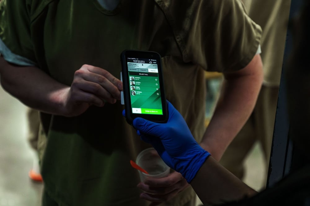 officer scanning ID card for headcount