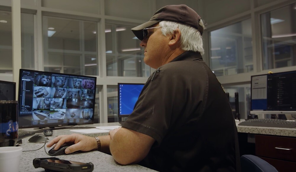 correctional officer looking at computer